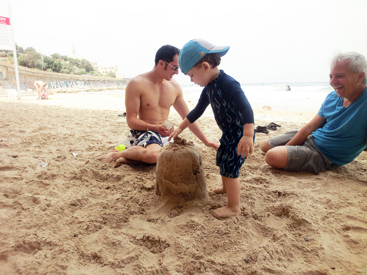 Description: Macintosh HD:Users:jbfisher 1:Desktop:summer2013travel:israel:small:beach_jumping_castlebuilding.jpg